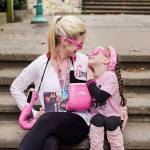 Janae Smith and daughter Brooklyn share a smile in their pink gear for breast cancer awareness. Courtesy of Jami West Photography