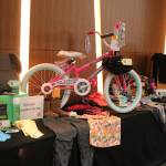 At the eighth annual Helping Kids Thrive Luncheon, held on Wednesday at the Meydenbauer in Bellevue, Eastside Baby Corner displayed examples of the items it donates to families in need. Eastside Baby Corner provides children in need with everything from their first bicycle to basic toiletries. Nicole Jennings, Reporter Newspapers