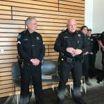 Kenmore Police Chief Cliff Sether (right) discusses deputy Gary Zornes long career serving the same community. Samantha Pak, Bothell/Kenmore Reporter