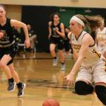 Inglemoor Highs Lucy Young, right, drives the ball up court against Lake Washington High on Monday. Andy Nystrom, Bothell-Kenmore Reporter