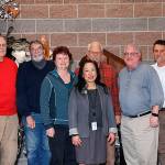 Fanny Yee (Center) stands among the Northshore Utility District Board of Commissioners along with Al Nelson (right), who is the incoming general manager. <em>Courtesy of the Northshore Utility District</em>
