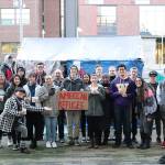 The Global Agitation class at the University of Washington Bothell, taught by Anida Yoeu Ali, in front of their final project, an art installation called American Refugee. Courtesy of Marwa Popal