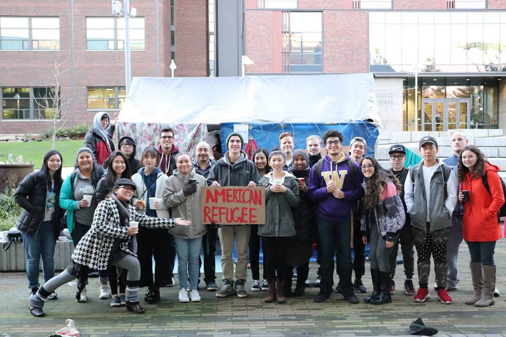 The Global Agitation class at the University of Washington Bothell, taught by Anida Yoeu Ali, in front of their final project, an art installation called American Refugee. Courtesy of Marwa Popal