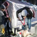 UW Bothell students work together to decide where barbed wire will go in their installation of a tent in a refugee camp. Samantha Pak, Bothell/Kenmore Reporter