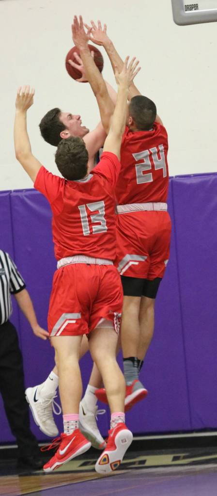 Bothells Jake Medjo takes on a pair of Mount Si defenders. Andy Nystrom, Reporter