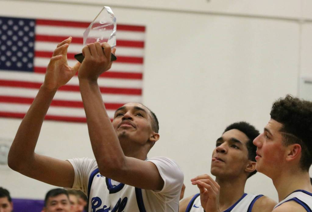 Bothells DaVicious Wilson and his teammates soak up the postgame celebration. Andy Nystrom, Reporter