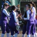 North Creek softball players converse on the mound during a recent game. Courtesy photo