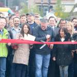 Mayor Rheaume cuts the ribbon after a group countdown from the crowd. Evan Pappas/Staff Photo