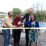 Kenmore Mayor David Baker, with Deputy Mayor Nigel Herbig and City Council members Milton Curtis and Debra Srebnik, cuts the ribbon at Rhododendron Park last Thursday. Photo courtesy of Becky Range/city of Kenmore