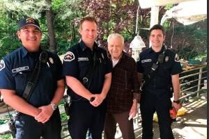 Bothell Firefighters install a smoke alarm. Photo courtesy of the Bothell Fire Department