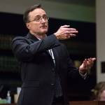 Snohomish County chief criminal deputy prosecutor Craig Matheson points his fingers like a gun as he makes opening statements at the Snohomish County Courthouse on Thursday in Everett in the trial of John Blaine Reed, accused of murdering Monique Patenaude and Patrick Shunn. (Andy Bronson / The Herald)