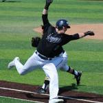 Eunsang Yu, behind, tags out a runner along the first-base line. Andy Nystrom / staff photo