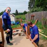 Volunteers build access ramps for locals