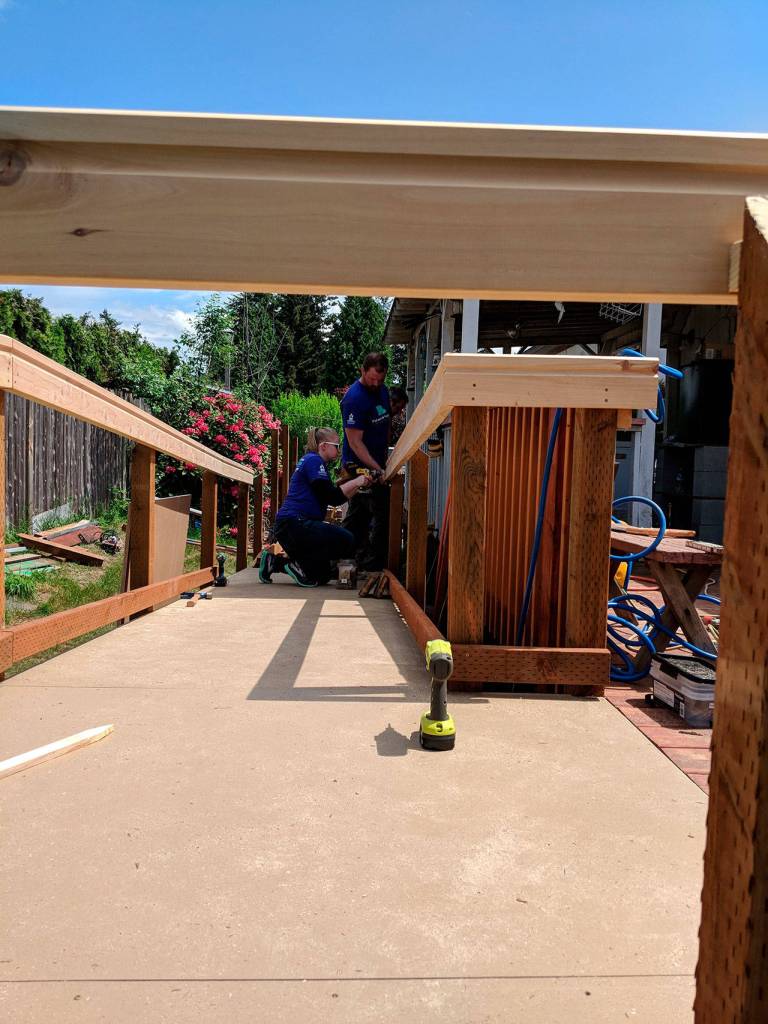 Volunteers build access ramps for locals