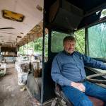 Charles Pillon sits inside one of the several buses on Iron Mountain. Photo by Caean Couto