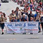 Boy Scouts carry a banner presenting this years parade theme: Red, White and Bothell. Photo courtesy of Greg Nelson