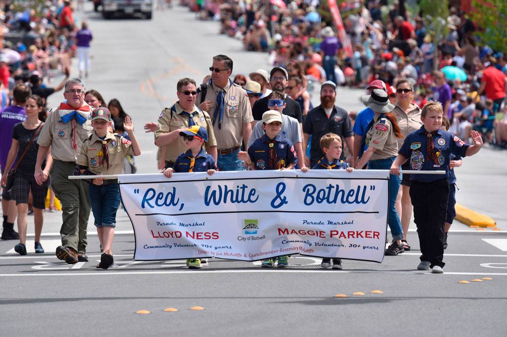 Boy Scouts carry a banner presenting this years parade theme: Red, White and Bothell. Photo courtesy of Greg Nelson