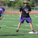 North Creek head coach Torrey Myers eyes two of his players at practice on Aug. 17. Andy Nystrom / staff photo