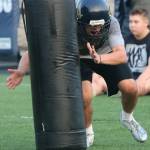 Cedar Park Christians Brandon Parrish heads toward a tackling pad during training on Aug. 16. Andy Nystrom / staff photo