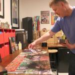 Greg McClellan of Kirkland assembles the complex album cover art puzzle for the first time. Madison Miller/staff photo.