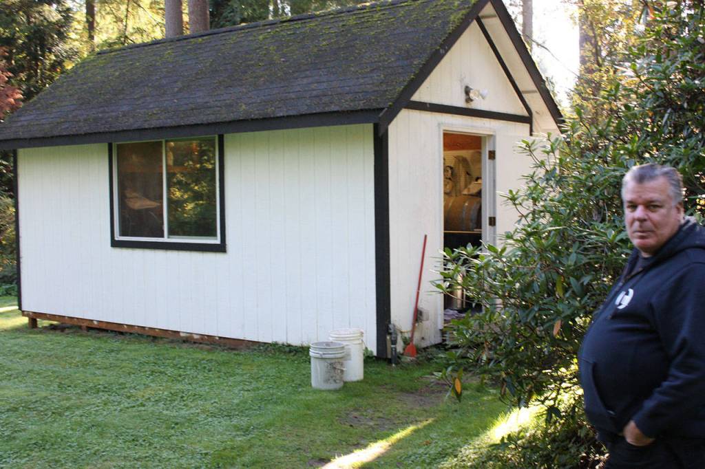 Co-owner Jim Jamison stands in front of the 200 square foot brewery at Foggy Noggin brewery in Bothell. It sits on his 2.5 acre property which also has a house, taproom and large yard. The micro-brewery was started in 2010. Aaron Kunkler/staff photo