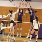 North Creeks Remington Atwood, middle left, and Allison Wilks team up for a block against Redmond. Scores in the thrilling match were North Creek, 25-17, 25-23 and 28-26. Andy Nystrom / staff photo