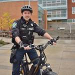 Bothell police officer Garrett Ware is the school resource officer at Bothell High School and said riding an electric bike helps him connect with the students, who think his bike is pretty cool. Photo courtesy of Judy Furlong