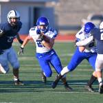 Bothells Branden Bird gets running against Chiawana. Photo courtesy of Greg Nelson