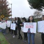 Skyline High School students and community protest perpetuation of rape culture following ISD lawsuit. Some signs read, Private Property with an image of a uterus. Another read, Blame rapists, NOT victims. another read, No More Silence. Madison Miller/staff photo.