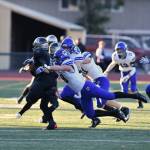 Cougar Kainoa China leads the way in wrapping up a Union runner. Courtesy of Greg Nelson