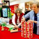 Volunteers from the North Bellevue Community Center offer grift wrapping Dec. 15 to 24, with proceeds going to their programs