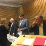 Kenmore Mayor David Baker addresses the crowd at a legislative town hall on Jan. 8, as Rep. Javier Valdez and Rep. Gerry Pollet chat with constituents. Katie Metzger/staff photo