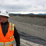 Scott Barden stands next to the pit which will house the newest, and possibly final, section of the Cedar Hills Regional Landfill near Maple Valley. The pi is 120 feet deep, and around another 180 feet will be built on top of it over the next decade. Aaron Kunkler/staff photo
