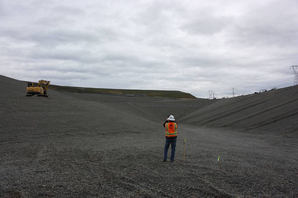 Scott Barden stands at the bottom of the massive pit of the landfills newly-built eighth section. Work on the new section has been underway for around two years. Photo by Aaron Kunkler
