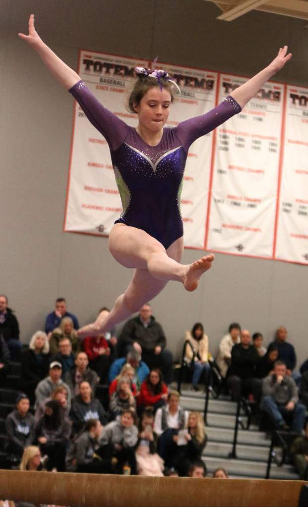 North Creeks Morgan Wyatt leaps to a tie for eighth place on beam at state. Andy Nystrom / staff photo