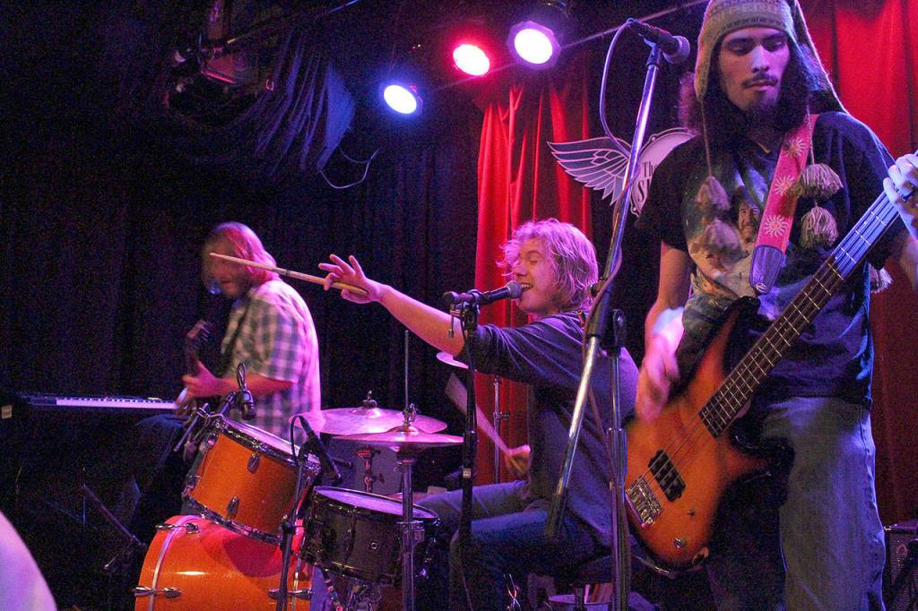 Asterhouse performs at the Skylark in West Seattle to raise money for the Northshore Fire Foundation. From left: Russ Thornburg, John Thornburg, and Julio Posada. Madison Miller/staff photo