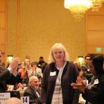 Outgoing Friends of Youth CEO, Terry Pottmeyer, receives a standing ovation at the Celebration of Youth luncheon. Madison Miller/staff photo.