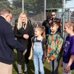 Violet Martinez and her two friends on either side meet Kenmore Mayor David Baker shortly before throwing the first pitch at Moorlands Park. Violet has Lymphoma and has begun to lose her hair after recently finishing her second round of chemo. Photo courtesy of Kenmore