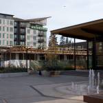 Work crews construct the first floor of Kenmores newest downtown development, the Flyway. The building is adjacent to the Hangar, Kenmores community center, and will be a mixed retail and residential space.