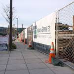Work crews construct the first floor of Kenmores newest downtown development, the Flyway. The building is adjacent to the Hangar, Kenmores community center, and will be a mixed retail and residential space.