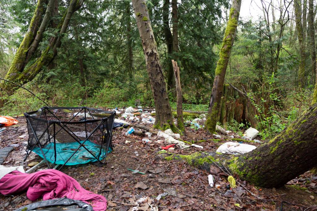 Garbage and personal possessions are left behind by those who occupied the outdoor space. Ashley Hiruko/staff photo