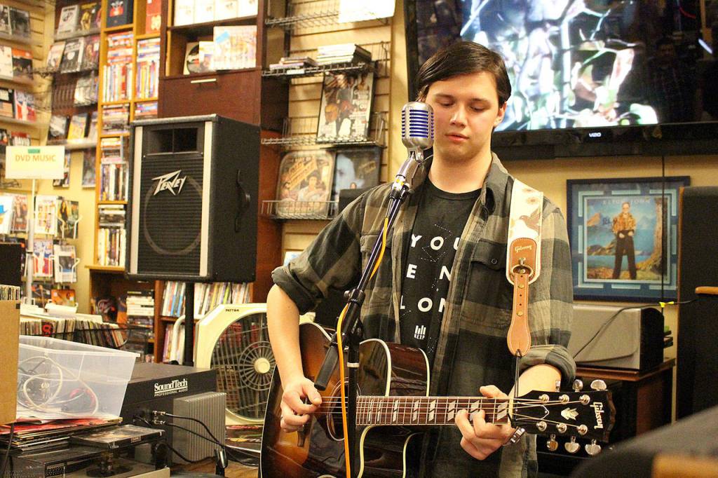 Elliot Austin performs an original song at Vortex on Record Store Day. Madison Miller / staff photo