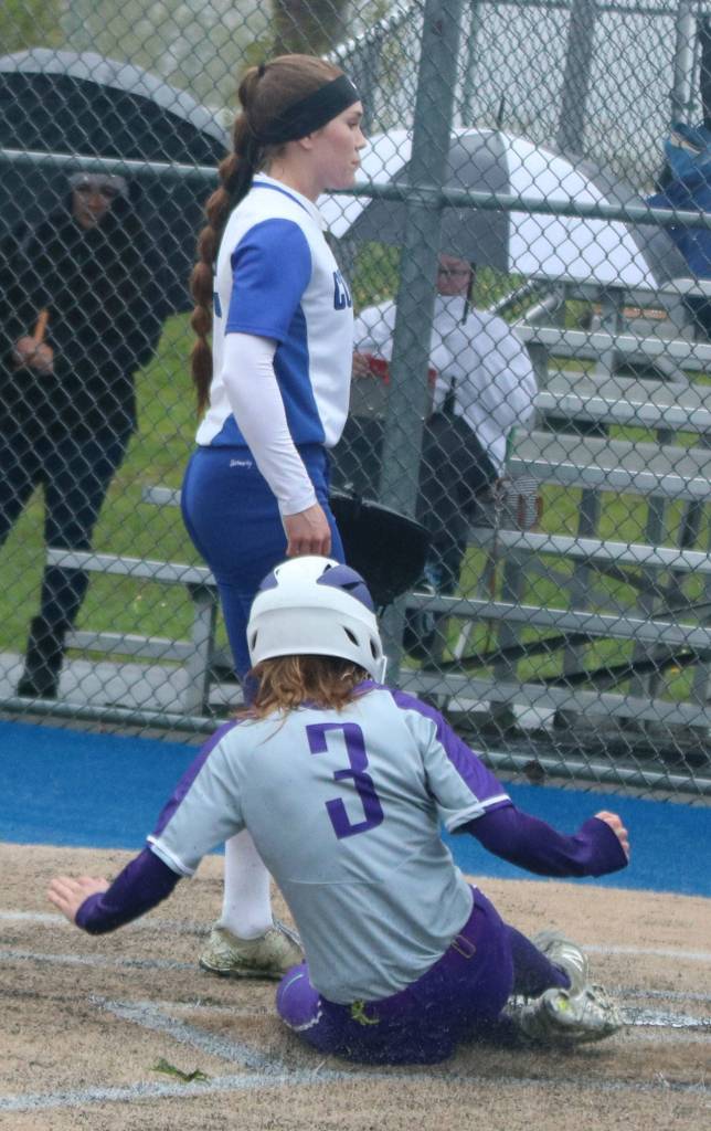 North Creeks Katie Ingersol slides in safely at home. Andy Nystrom / staff photo