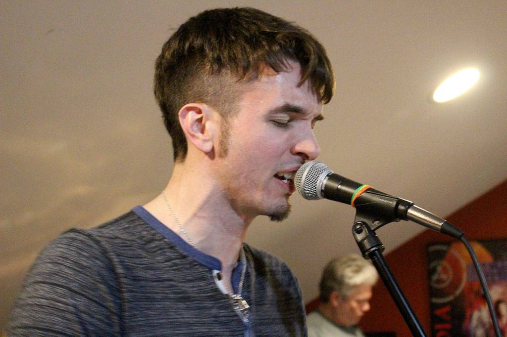 Michael Henrichsen rehearses with Nite Wave. Madison Miller / staff photo