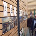 Workshop attendees examine vote on their favorite photo from the For the Love of Kenmore photography contest. Kailan Manandic/staff photo