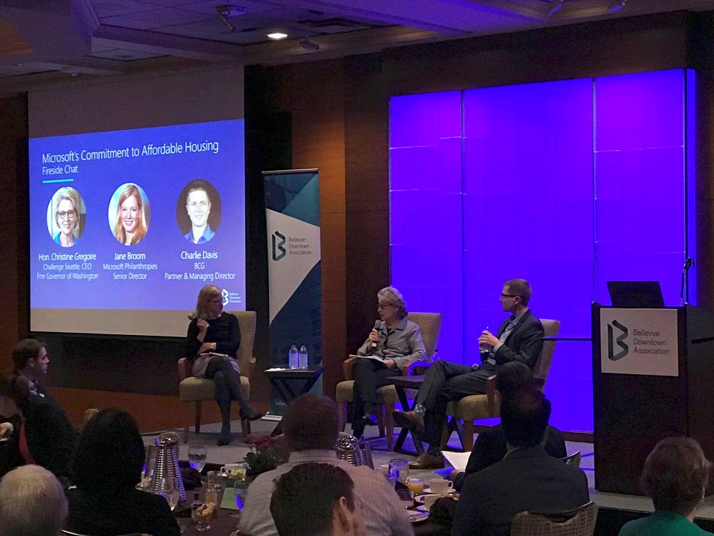 (Left to right) Jane Broom, Microsoft Philanthropies senior director, former Washongton Gov. Christine Gregoir, who now serves as CEO of Challenge Seattle, and Charlie Davis, partner and managing director at the Boston Consulting Group, speak on Microsofts $500 million commitment to affordable housing at a panel discussion during a Bellevue Downtown Association breakfast.                                 Kailan Manandic / staff photo