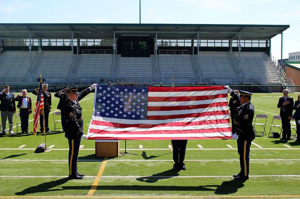 Madison Miller / staff photo                                 The color guard presents the American flag toward the end of the dedication ceremony at Pop Keeney Stadium.