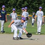 Kody Moyer fields a ball while some of his North Bothell teammates wait their turns during practice at the Northshore Athletic Fields last week. Andy Nystrom/ staff photo