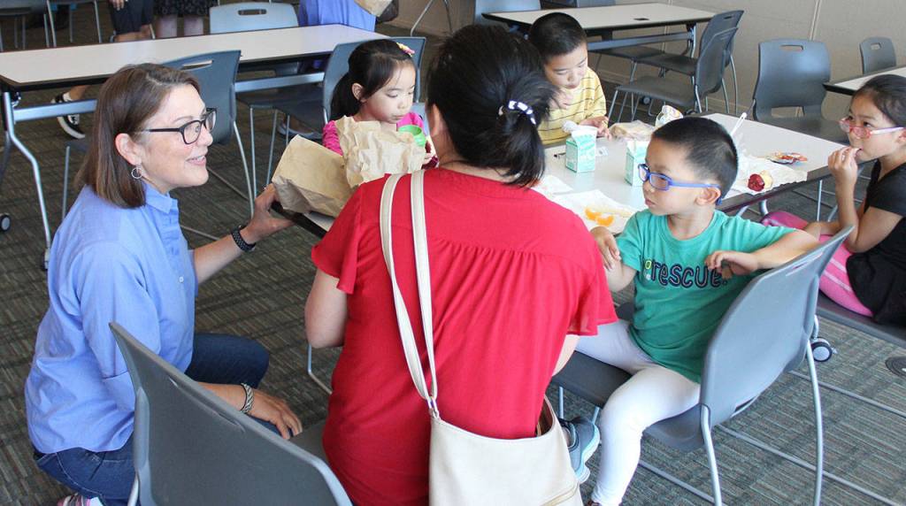 Rep. DelBene chats with one of the families who came to the event. Blake Peterson/staff photo