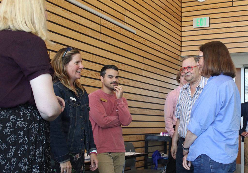 Rep. DelBene talks with YMCA staff and Mayor David Baker. Blake Peterson/staff photo